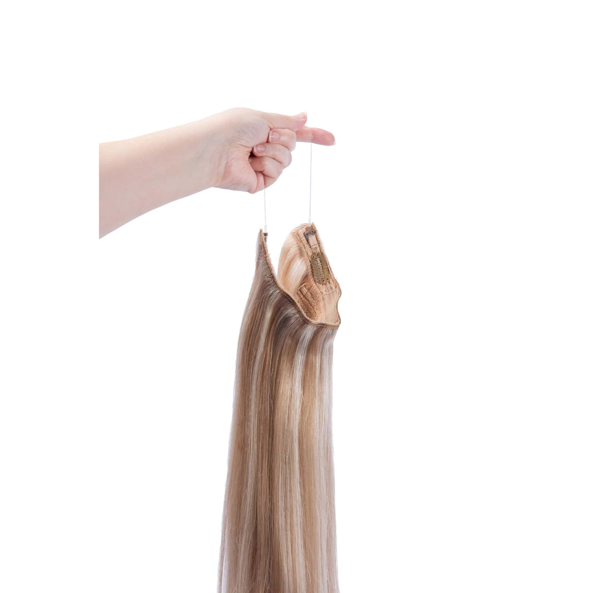 Hand Holding Biscuit Blondey (#18/613) Halo Hair Extensions