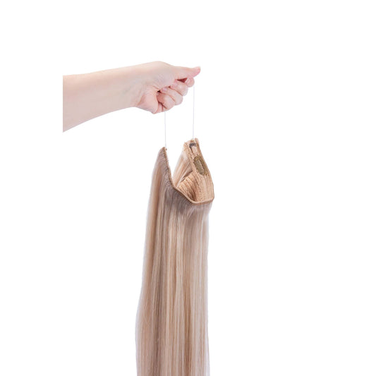 Hand Holding Light Ash Blonde (#22) Halo Hair Extensions