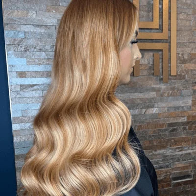 strawberry blonde tape in hair extensions